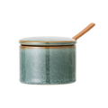 Gefäß mit Deckel und Holzlöffel
