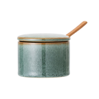 Gefäß mit Deckel und Holzlöffel